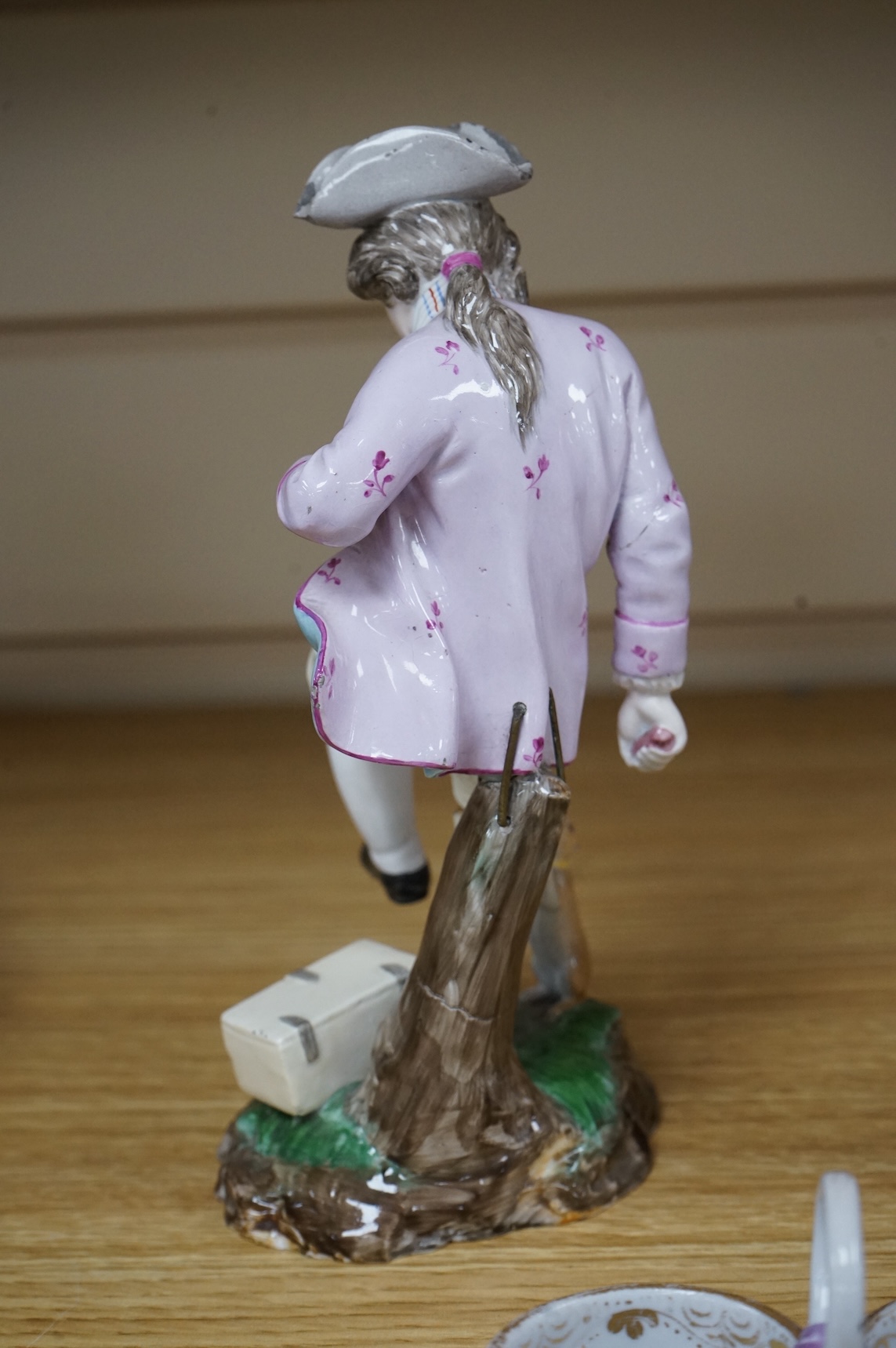 A pair of 19th century Hochst Damm faience figures and a Meissen twin section salt, tallest figure 20cm